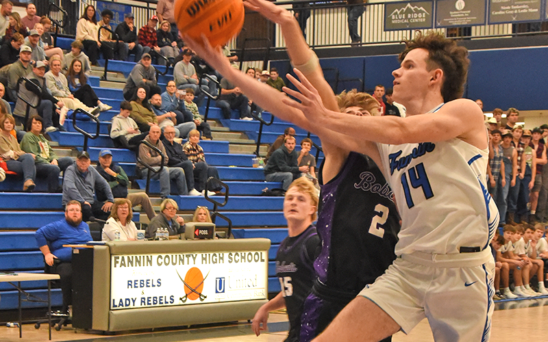 Brody Henson goes for  a layup against Gilmer County.
