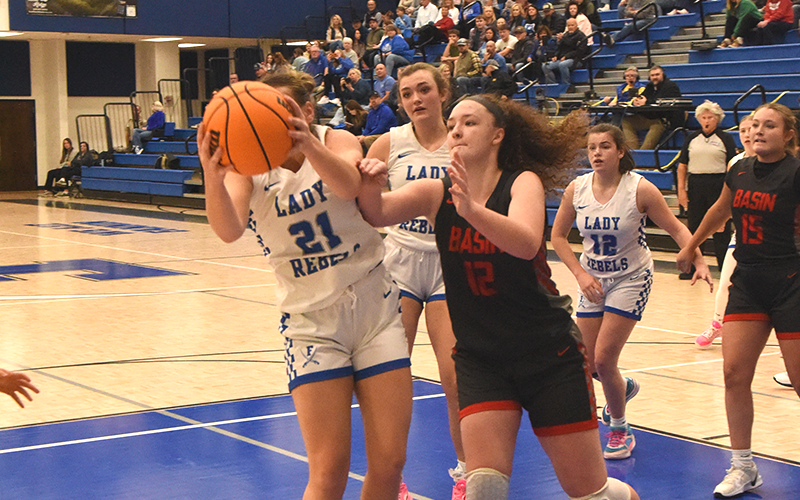Fannin County’s Maggie Ledford (21) battled Copper Basin’s Kloie Ballew for this rebound. Also shown are Fannin’s Reese Lewis and Toccoa Hampton (12).