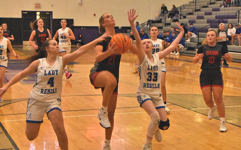 Fannin County’s Braylee Davenport (#4) and Kylie Breeden (#33) defend against Copper Basin’s Alexis Hyatt in the Piedmont Holiday Classic tournament Saturday.