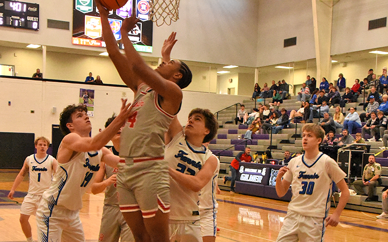 Copper Basin’s Darrius Harris works his way between Fannin County defenders for a two-point attempt.