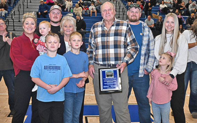 The Fannin County High School gymnasium has been named the Coach Johnny Farmer Gymnasium. Farmer, who coached for over 30 years in the Fannin County School System, was honored at a dedication ceremony December 13. Members of Farmer’s family were on hand and honored also. Farmer, holding a plaque, is shown with family members Brianna Farmer, Navy Farmer, Neyland Farmer, Jordan Farmer, Donna Farmer, Deacon Farmer, Coach Farmer, Jonathan Farmer, Deana Farmer and Lindsey Farmer.