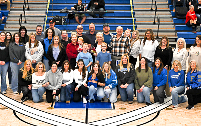 Several of Coach Johnny Farmer’s former players joined the honoree and his family during the naming of the Fannin County High School gym Saturday.