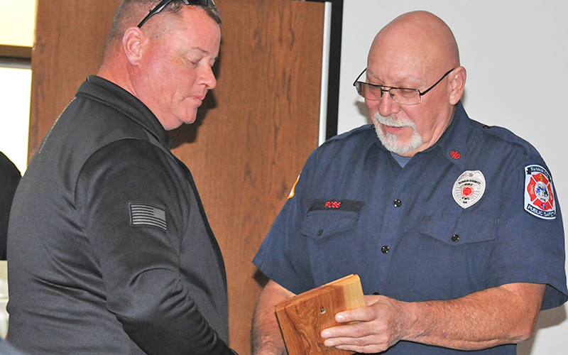 Justin Turner (left) accepts the Officer Of The Year award from Deputy Fire Chief Rob Ross at the Fannin County Fire Department’s annual Christmas dinner.