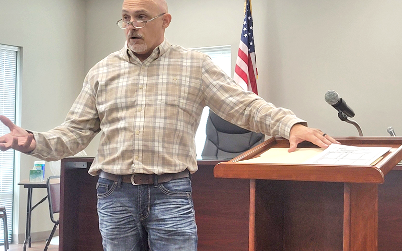 Cline Bowers describes his water plant’s operation to members of the Fannin County Water Authority last week. Fannin commissioners were at the meeting.