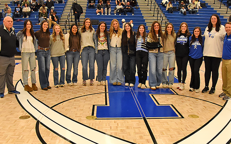 Members of the 2021 Lady Rebels basketball team recognized last Tuesday night were, from left, Coach Randy Hallmark, Reigan O’Neal, Becca Ledford, Mackenzie Johnson-Postell, Prisila Bautista, Olivia Sisson-Rhodes, Natalie Thomas, Ava Queen, Paige Foresman, Courtney Davis, Reagan York, Riley Reeves, Abby Ledford, Jenna Young, Coach Megan Orton and Head Coach Ryan Chastain.
