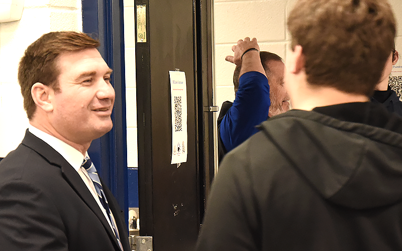 RIGHT: David Nichols, the new Fannin County Rebels head football coach, talks with CJ Reece Thursday night at the high school cafeteria.