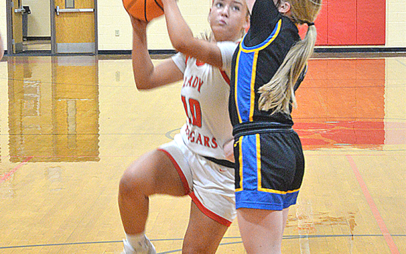 Copper Basin Lady Cougar Kendra Deal (#10) outmaneuvers her Lookout Valley opponent for the successful jumper. The game was in school February 17.