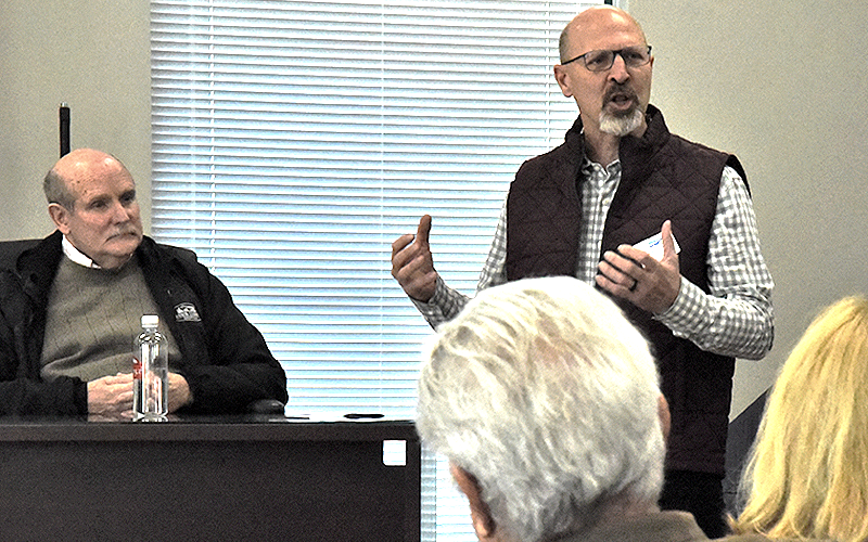 Rob Kaser, who leads the Leadership Fannin program for the Chamber of Commerce &amp; CVB, discusses how the county government works during a session at the Fannin County courthouse. Listening is Post 2 Commissioner Glenn Patterson, left.