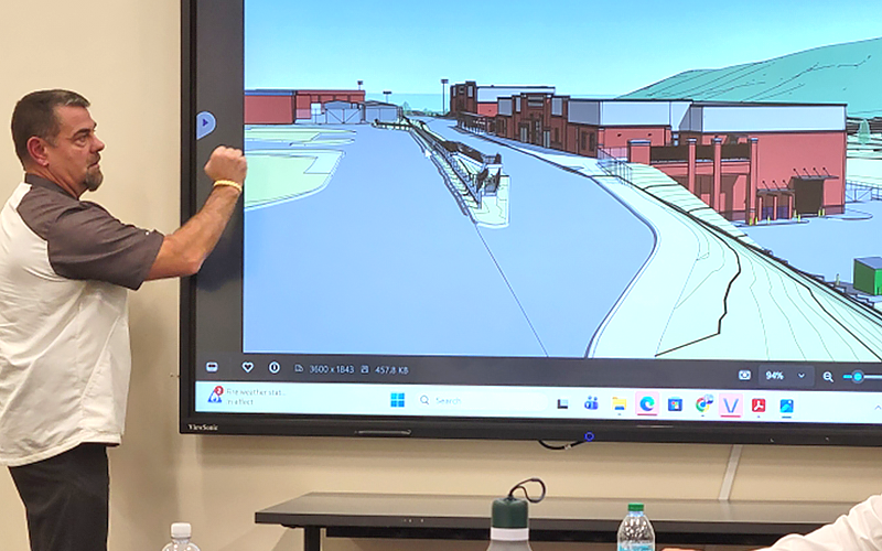 Fannin County School System Chief Operations Officer Darren Danner discusses a rendering of the new CTAE facility during a school board workshop last week.
