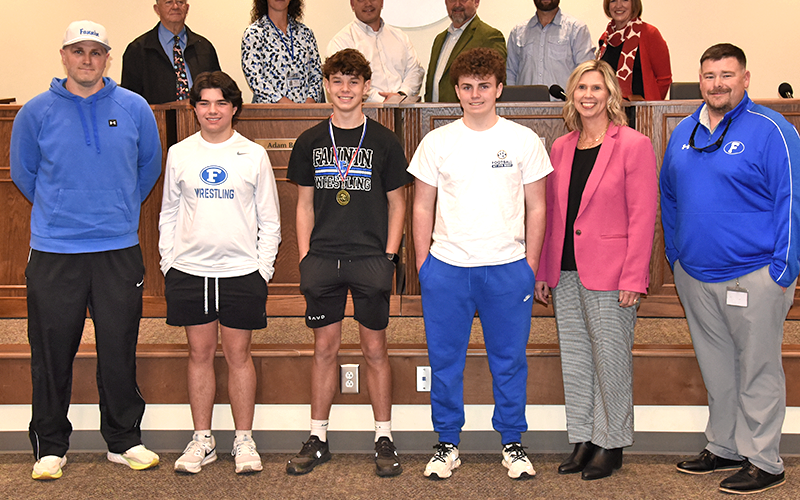 Fannin County Middle School wrestlers were honored for their tournament accomplishments by the Fannin County Board of Education. Shown during the ceremony at the February 12 school board meeting are, from left, front, Coach Josh Snider, Grayson Woody, Clay Maddox, Luke Snider, FCMS Principal Dr. Arpil Hodges and FCMS Assistant Principal Chuck Patterson; and back, board members Bobby Bearden, Ashley H. Weeks, Adam Born, Mike Cole, Robert Patterson, and School Superintendent Shannon Dillard.