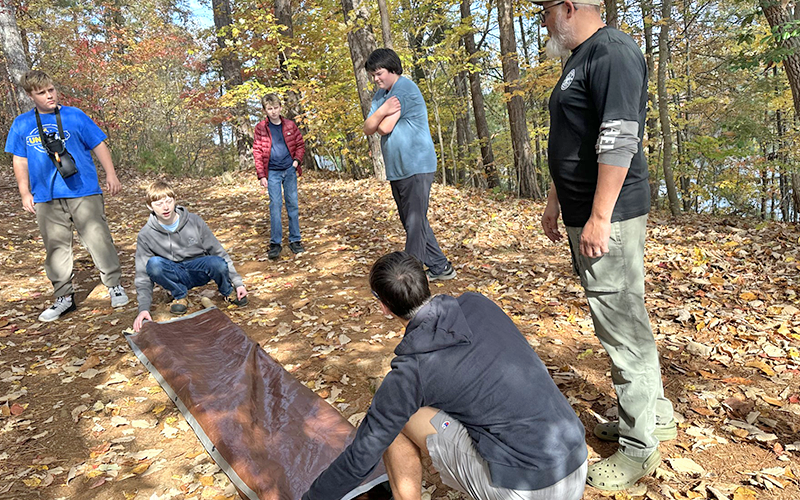 Troop 32 scouts learn how to build a makeshift stretcher, which could become necessary for an unexpected accident deep in the forest.