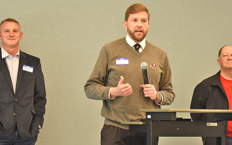 Former Fannin County School Superintendent Dr. Michael Gwatney, flanked by school board member Bobby Bearden, right, and former board member Chad Golloway, talked about the role the school system played in the new Fannin County Public Library.