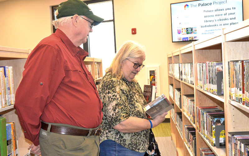 News Observer photo/Enola Patterson: Community members browse the DVD and movie section of the new Fannin County Public Library during it’s grand opening March 7.