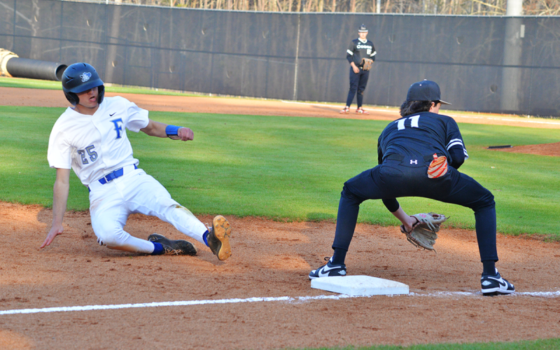 News Observer Photo/Jason Queen Fannin County’s Rylin Davis slides into third base in the Rebels’ 11-1 win over Coosa Thursday, March 19.