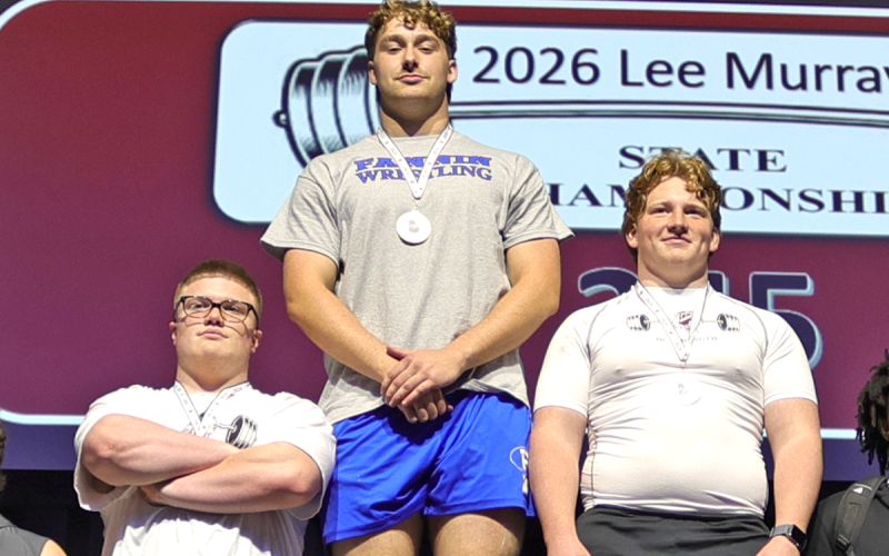 Fannin high weightlifter Isaac Watkins, center, took home the top prize at the Lee Murray State Weightlifting Championships March 7. He was competing in the 245-pound class