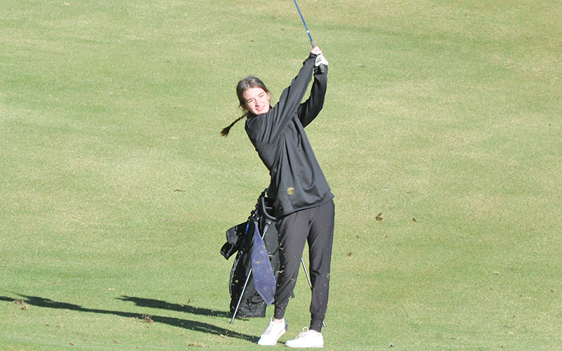 Olivia Ford hits a fairway shot.