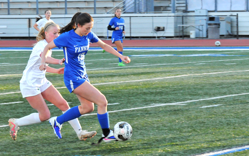 Fannin County Lady Rebel Avi Ethington (#19) controls the ball and her Pickens opponent March 12.