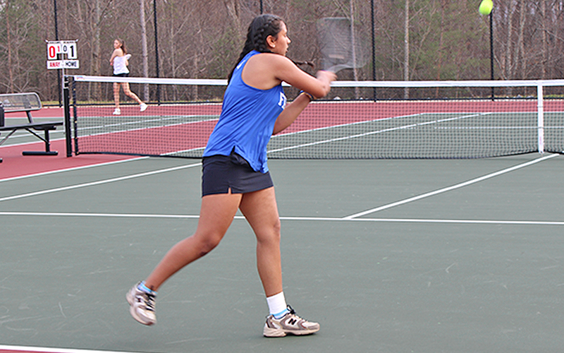 Fannin County High School’s  number three singles player Krishvee Panchel returns the ball in recent action.