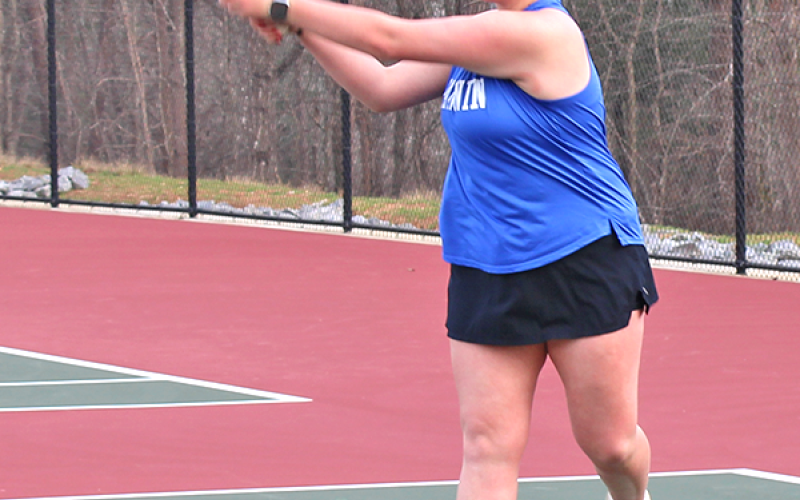 Fannin County High School girls tennis team member Kendall Clore competes in girls doubles and is seen hitting her shot from the back of the court at the school’s match March 4.