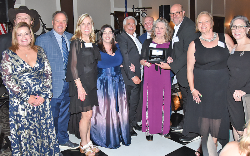News Observer photo/Glenn Harbison The Community Service Award presented by the Chamber of Commerce went to the Blue Ridge Business Association. Shown during the presentation of the honor Saturday night are, from left, Susan Ross (front), Justin Farrington, Russ DeSena, Kim Duetsch, Christie Lucas, Cesar Martinez, Andy Rhodes, Pam Fink, Troy Shirbroun, Jamie Davis, and Helen Huntley.