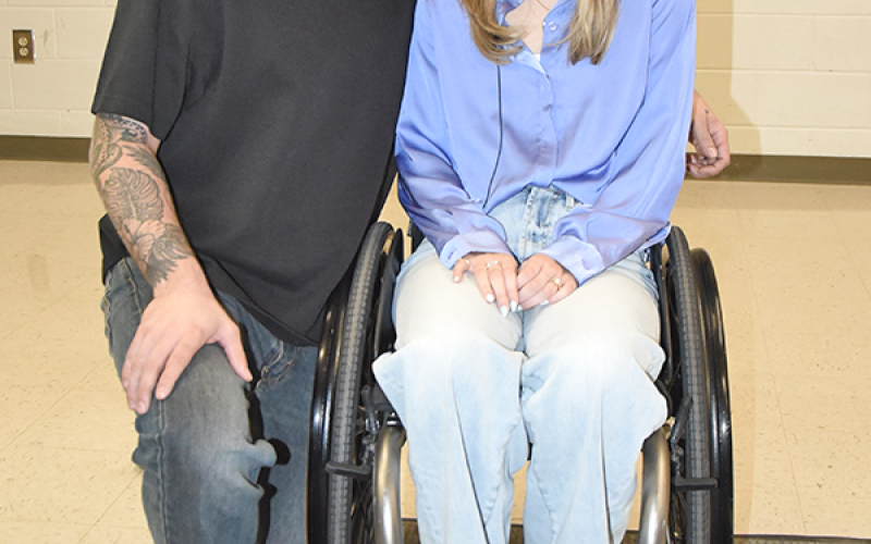 Emma Benoit is shown with her husband, Evan, before telling students about the devastating effects of suicide.