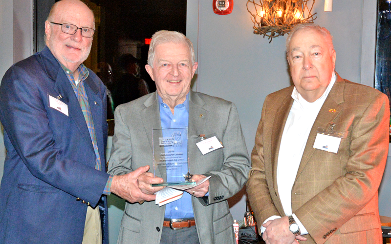 The Marine Corps League #1438 Toys for Tots program was recognized as the Community Non-Profit Champion during Snack in a Backpack’s annual Champions for Children Fundraiser March 2. Shown are, from left, Dale Greene and Jim Brumbelow with Toys for Tots and Snack in a Backpack board Treasurer Jeff O’Neill.