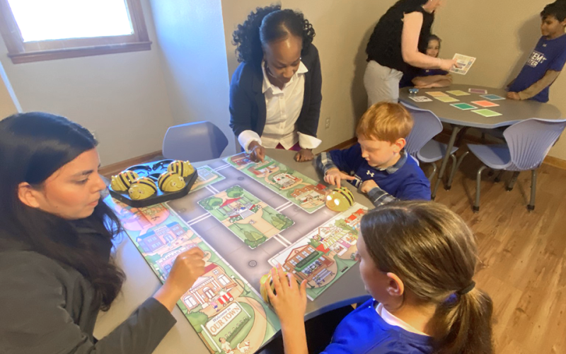 News Observer Photo/Jason Queen Fannin County Recreation Department held a ribbon cutting for its Cal Ripken STEM Center March 12 and attendees and children participated in science related activities. Pictured are, from left, front table, TVA representative Edith Perez, TVA Representative Trina Gallman, Leah Hughes, and Sam Kochish using a coding bug box. In the background, from left, standing, Recreation Department Education Coordinator Jade Graham helps Anniston Graham and Bradford Carpenter learn about p