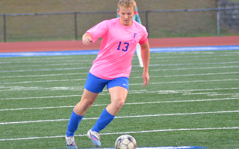 Fannin High School Rebel Gage Flowers drives the ball down the open field to gain the advantage in recent action at home.