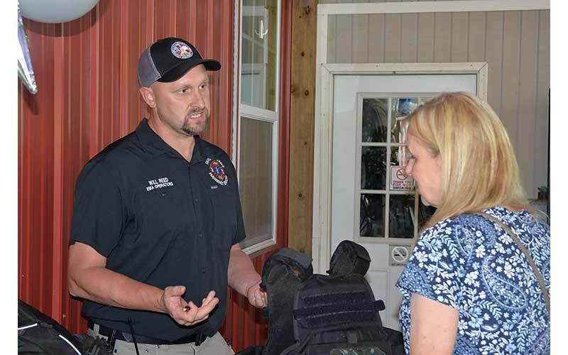 News Observer photo/Mollie Morrow - Will Reed with the Fannin County Emergency Management Agency speaks of some needs during Impact100 Fannin's Non-Profit Fair and Big Reveal June 9.