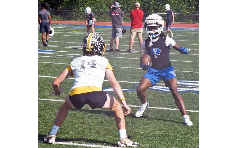 News Observer photo/Jason Queen - Fannin County Rebel Ryan Preston (right) attempts to get around his Murphy opponent in 7-on-7 action at the school's stadium June 11.