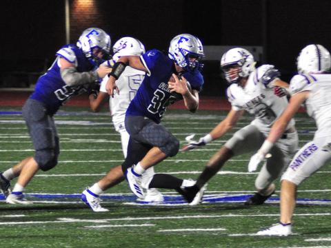 Fannin Rebel Will Mosely (35) powers through the Panther defense for a big gain during the Rebels game with the Union County Panthers Friday, September 13.
