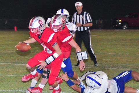 Copper Basin running back Chance Bailey (42) blocks as quarterback Bryson Grabowski (13) slips past a Sale Creek defender for a touchdown during Copper Basin’s game against the Panthers Friday, September 6.
