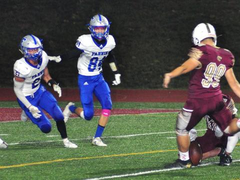 Fannin Rebels Treylyn Owensby (21) and JoJo Goodwin (84) rush to block a field goal during the Rebels region game with the Dawson County Tigers Friday, October 25.