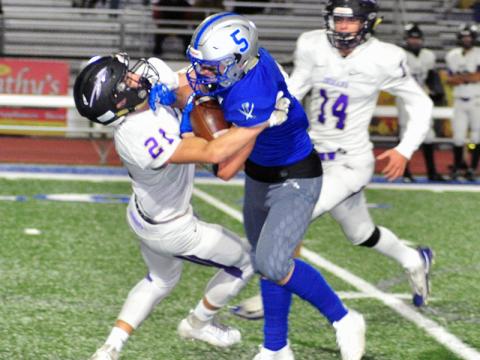 Fannin Rebel Seth Reece (5) plows through a defender during the Rebels region win against Lumpkin County Friday, November 1.