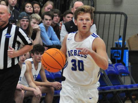 Senior Rebel Jerritt Holloway leads a fastbreak in Fannin’s win against the Raiders Tuesday, November 19.