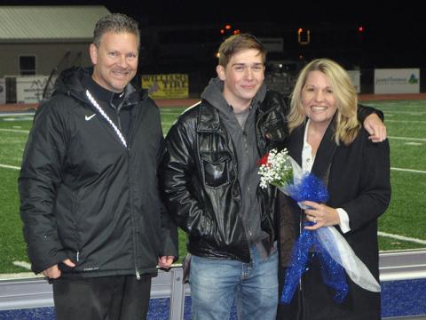 Fannin County cross country senior Nick Leymeister was honored at Fannin’s last home game of the season Friday, November 8. He is shown with principal Erik Cioffi and Christine Callihan.