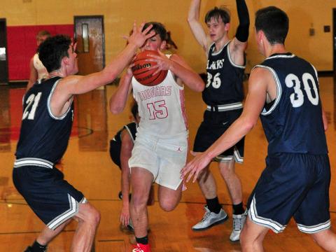 Copper Basin Cougar Tim Jabaley fights his way to the rim in recent action for the Cougars. Copper Basin beat Sale Creek to start 1-0 in district play.