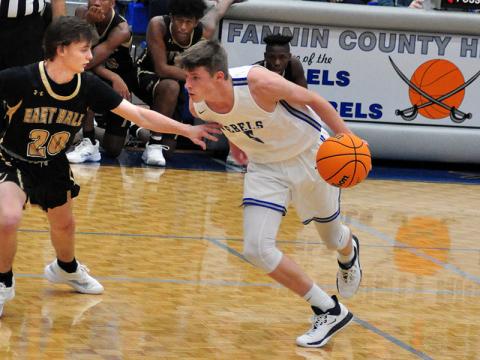 Fannin Rebel Kaeden Twiggs gets around an East Hall defender during the Rebels region game with East Hall Tuesday, December 17.