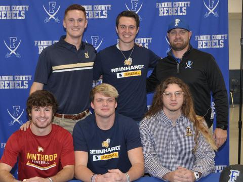 Five Fannin County Rebel baseball players signed scholarships to further their academic and athletic careers at four schools Friday, December 13. Shown following the signing ceremony are, from left, front, Carson Beavers, Blake Rogers, Hunter Gray; back, Matthew Shirah, Gabe Buchanan and Rebels baseball head coach Travis Stone.