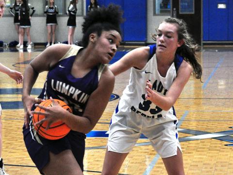 Lady Rebel Reagan York clamps down on a ball handler in recent action for Fannin County.