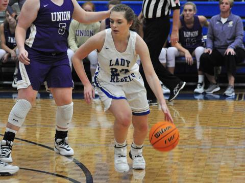 Lady Rebel Abby Ledford dribbles to the left side of the court to run a play during the Lady Rebels 52-47 win over the Union County Lady Panthers Saturday, December 7.