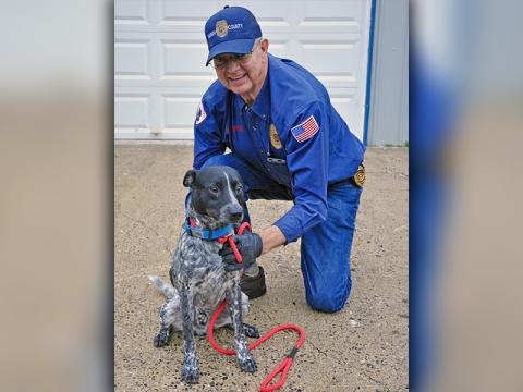 Animal Control Officer Pat Patterson shows off this male Blue Heeler that was picked up December 12 on Weaver Street in McCaysville. He will be staying at Animal Control until reclaimed or adopted. This energetic guy has a peppered black and white coat. View him under Animal Control number 355-19.