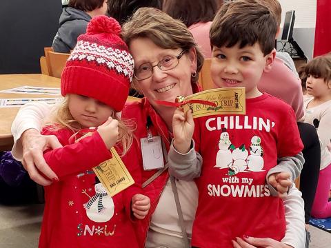 Amiyah Cioffi, left, and Easton Cioffi check out their golden tickets for The Polar Express at the East Polk County Library in Ducktown. They attended the special reading of the popular children’s book at the library Monday, December 9. Theresa Dillard was on hand to make sure they “boarded the right train.” More photos from the event can be found on A7. Also, a story and pictures from Dillard’s retirement reception at Fannin County High School can be found on A3.