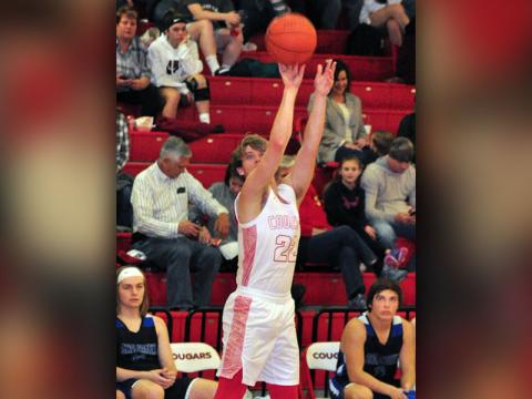 Copper Basin Cougar Nate Deal sinks a three-point basket during the Cougars district match with the Sale Creek Panthers Friday, January, 24.