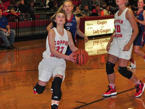 Lady Cougar Emily Hemming gathers for a lay-up in recent action for the Copper Basin Lady Cougars basketball team.