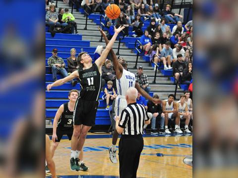 Fannin Rebel Andre Bivens goes up for the tip during the Rebels basketball game with the North Hall Trojans Tuesday, January 14.
