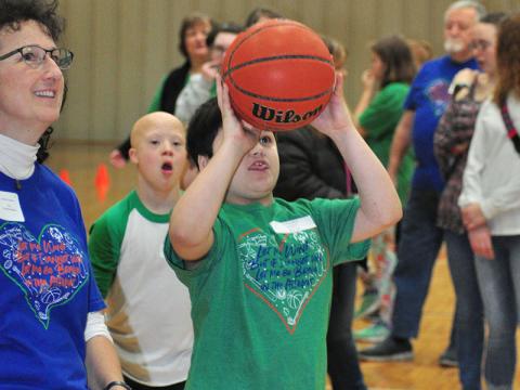 Special Olympics athlete Damian Hilton goes up for a bucket during the Fannin County Special Olympics basketball competition at the Fannin County Recreation Center Friday, January 31.