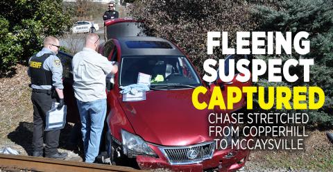 Polk County Deputy Manuel Patterson, left, and Detective Jake Wallace search the vehicle driven by Matthew Alexander Rich.