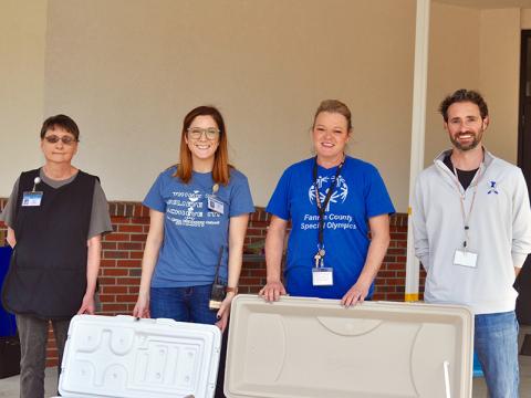 The Fannin County School System is distributing meals to students who need them during the closure caused by COVID-19. Shown distributing meals at Blue Ridge Elementary School are, from left, nutrition staff member Theresa Ray, Parent Liaison Holly Ross, paraprofessional Wendi Hood and Director of Applied & Integrated Instruction Lucas Roof.