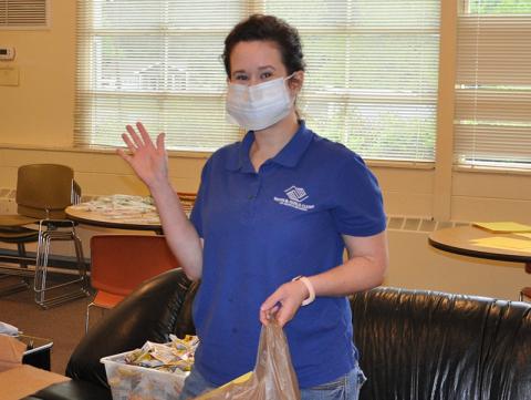 Staff members of Boys & Girls Clubs of North Georgia’s Fannin County club were busy preparing “learning kits” for their children Thursday, April 30. Waving is Club Director Victoria Turner.